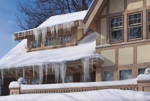 snow and ice covering a house